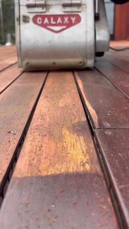 Sand backwards along the deck boards